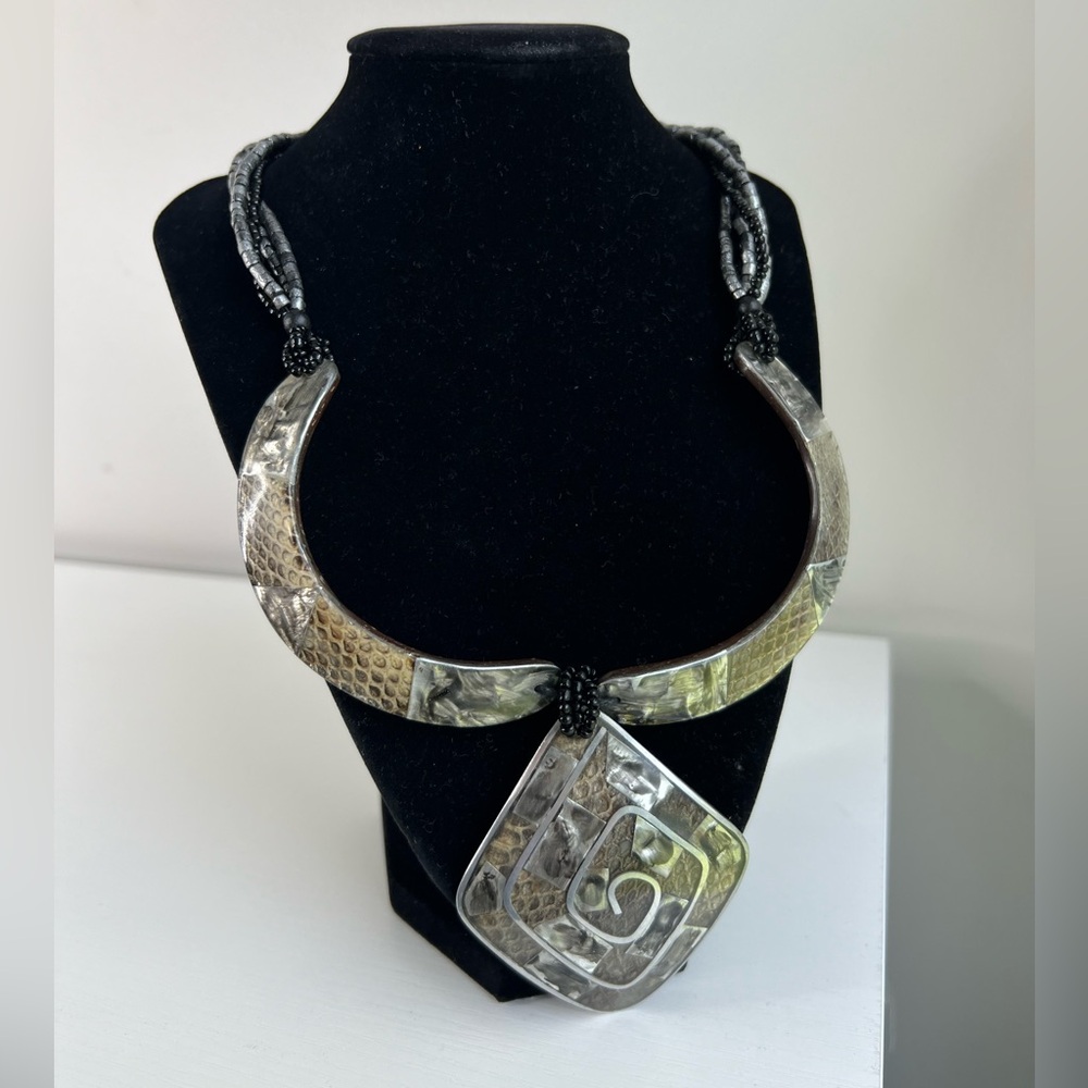 Bead, metal and mother of pearl bib, door knocker necklace.